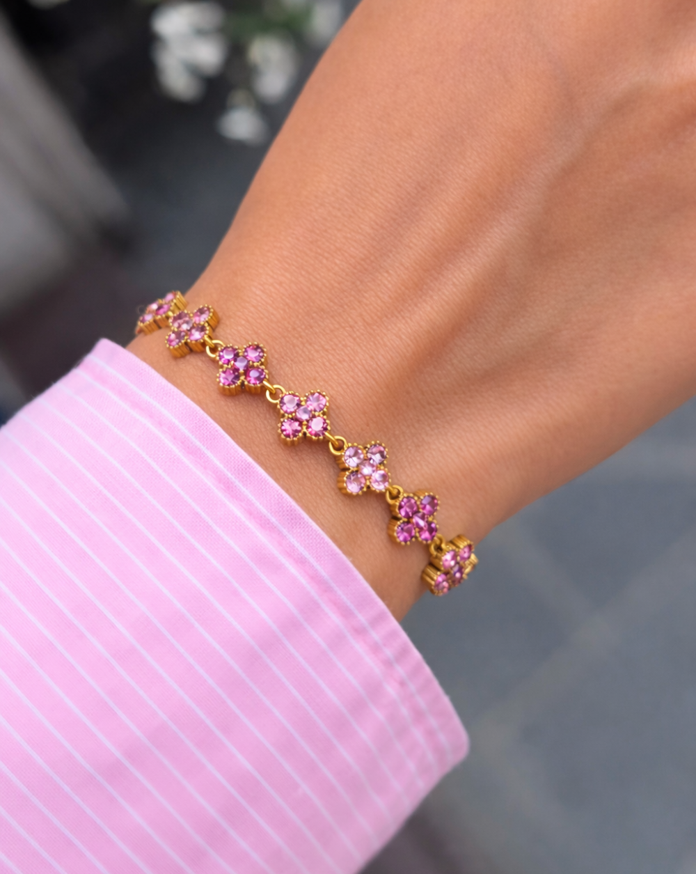 Zapestnici iz nerjavečega jekla z rožicami v rožnati in prozorni barvi – Trgovina Patrizia Ljubljana.