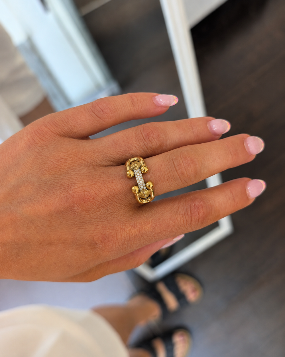 Gold PAVÉ BOND " Ring " in stainless steel, featuring an intertwined link design and transparent pavé crystals – Trgovina Patrizia Ljubljana.