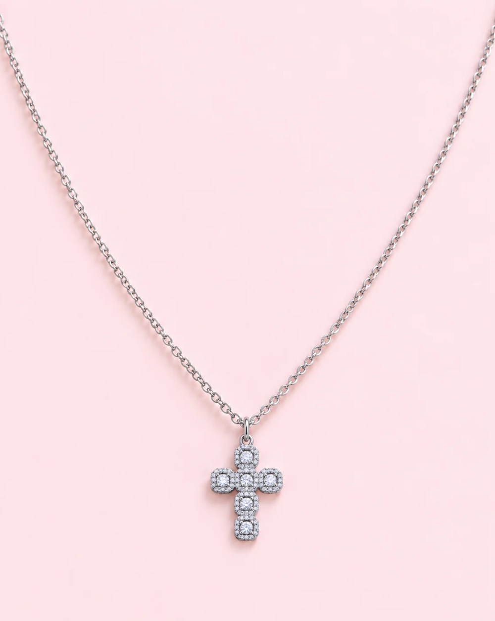 Gold necklace ROYAL CROSS, made of stainless steel, with a cross-shaped pendant adorned with brown and pink crystals and tiny sparkling stones— Trgovina Patrizia , Ljubljana.