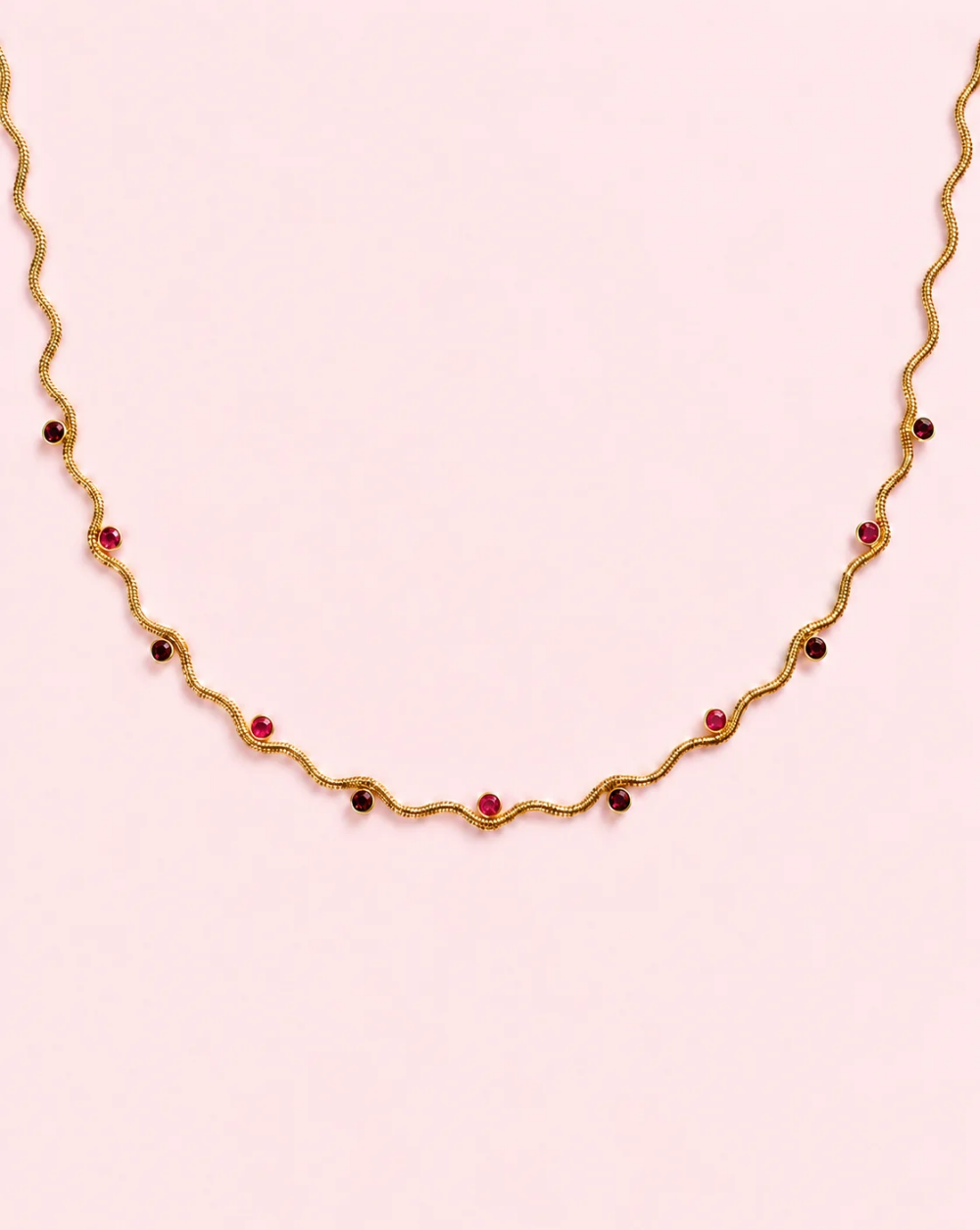 Necklace WAVY GLOW, made of stainless steel with a wavy chain and tiny round sparkling crystals arranged along the chain— Trgovina Patrizia , Ljubljana.
