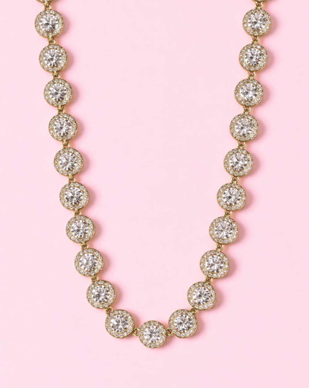 OPHELIA stainless steel Necklace zirconia stones in gold, shown on a pink background – Trgovina Patrizia .