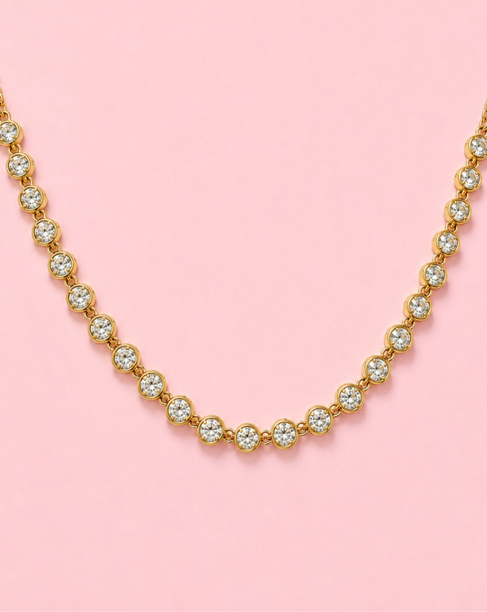 Gold necklace SOLITAIRE, made of stainless steel with clear, sparkling crystals – Trgovina Patrizia Ljubljana.
