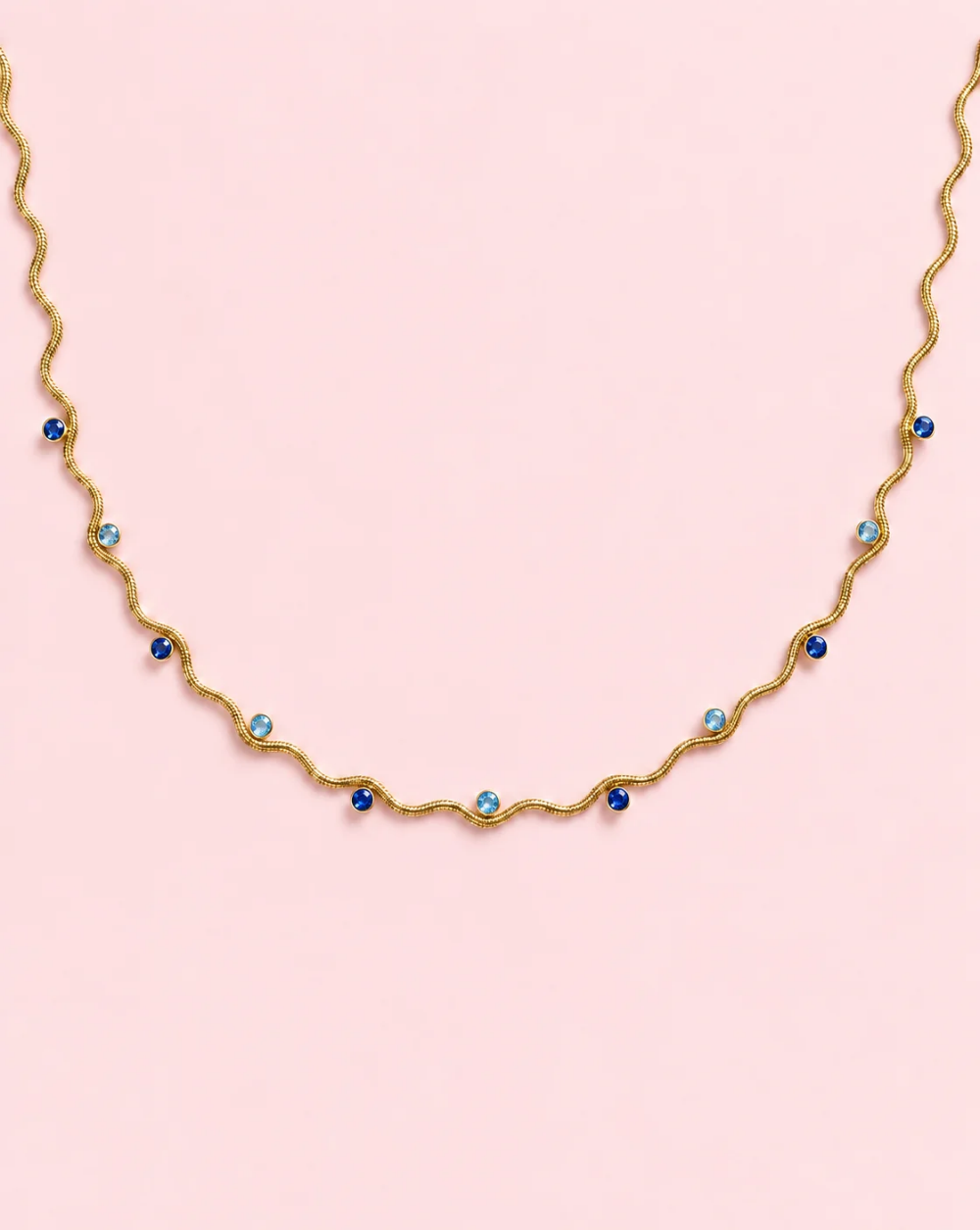 Necklace WAVY GLOW, made of stainless steel with a wavy chain and tiny round sparkling crystals arranged along the chain— Trgovina Patrizia , Ljubljana.